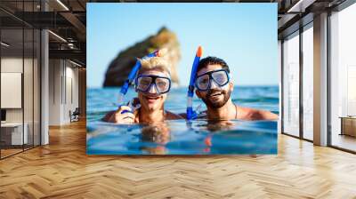 Happy friends men enjoying summer vacation and scuba diving Wall mural