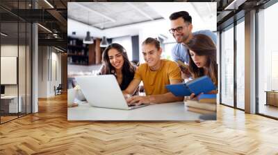 Happy group of young students studying together Wall mural