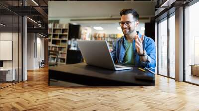 Happy man working on laptop. Technology people work study concept Wall mural