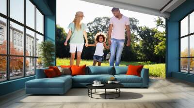 Happy multiethnic family having fun together outdoors. People love happiness concept Wall mural