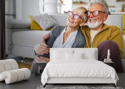 Happy romantic senior couple hugging and enjoying retirement at home Wall mural