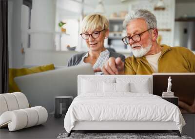 Happy romantic senior couple hugging and enjoying retirement at home Wall mural