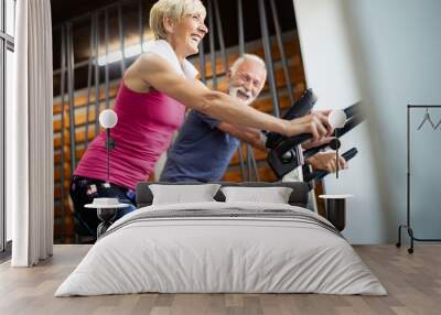 Happy senior people doing exercises in gym to stay fit Wall mural