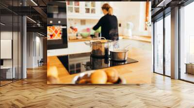 Housewife making lunch in kitchen Wall mural