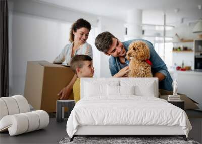 Husband and wife and their son with pet moving in new home. Wall mural