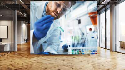 Male student of chemistry working in laboratory Wall mural