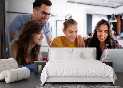 Multiracial young people enjoying group study at table. Wall mural