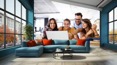 Multiracial young people enjoying group study at table. Wall mural