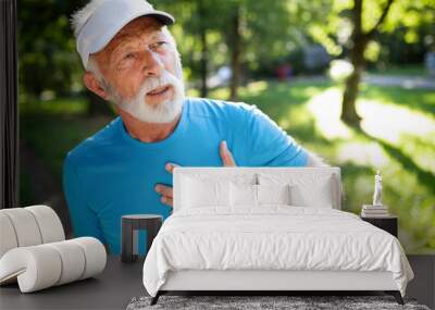 Older man heart attack after running workout outdoor Wall mural