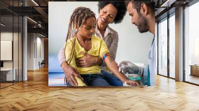 Pediatrician takes blood from a child patient. Healthcare antibody test coronavirus concept Wall mural