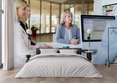 Picture of attractive saleswoman on meeting in office Wall mural