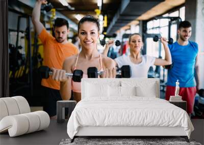 Picture of cheerful fitness team in gym Wall mural