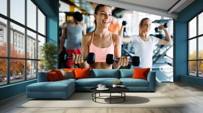 Picture of cheerful fitness team in gym Wall mural