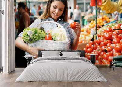 Picture of woman at marketplace buying fruits Wall mural