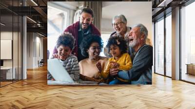 Portrait of a happy multigenerational multiethnic family at home. Wall mural