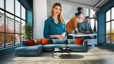 Portrait of beautiful business woman in front of business team. Office success people concept Wall mural