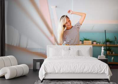 Portrait of beautiful young happy woman smiling and having fun Wall mural