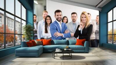 Portrait of business team posing in office Wall mural