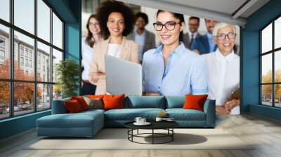 Portrait of business team posing in office Wall mural