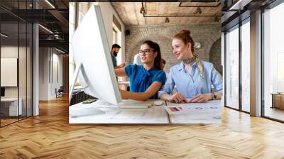 Portrait of business women working together in corporate office. Finance architect startup concept Wall mural