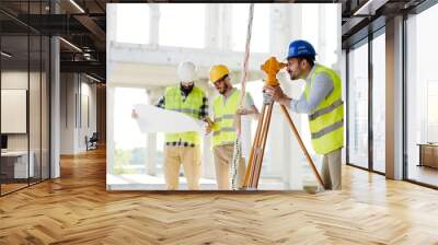 Portrait of construction engineers working on building site Wall mural