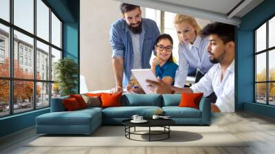 Portrait of creative business people team working together and smiling in office. Wall mural