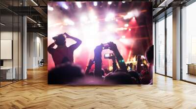 Portrait of happy crowd enjoying at music festival Wall mural