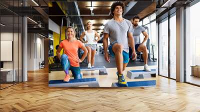 Portrait of happy fit people, friends exercising in gym together. Sport people workout concept Wall mural