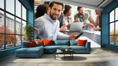 Portrait of happy success man working in a busy modern workplace, Startup coworker concept Wall mural