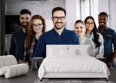 Portrait of successful business team posing in office Wall mural