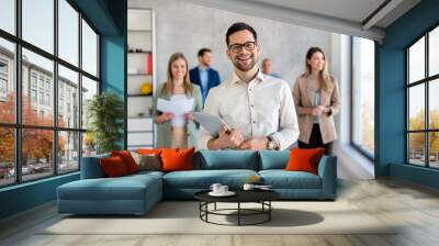 Portrait of successful company with happy business poeple Wall mural