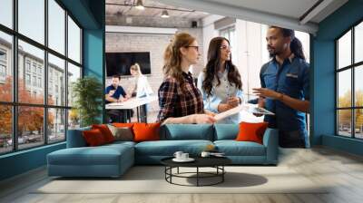 Portrait of young architects discussing in office Wall mural