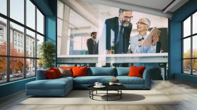 Senior business accountants working together at modern office Wall mural