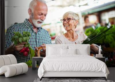 shopping, food, sale, consumerism and people concept - happy senior couple buying fresh food Wall mural