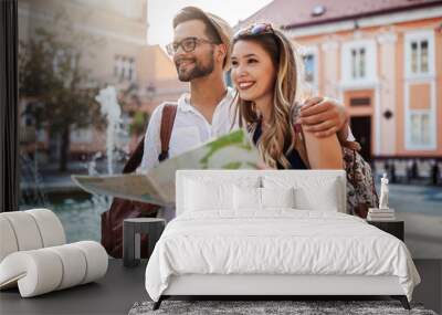 Summer holidays, dating, love and tourism concept. Smiling couple in the city Wall mural