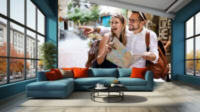 Summer holidays, dating, love and tourism concept. Smiling couple in the city Wall mural