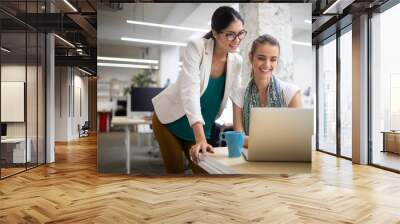 Team of colleagues brainstorming together while working in modern office Wall mural