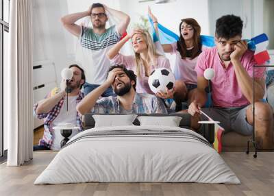 Upset friends watching football game Wall mural