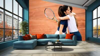 Women tennis player handshaking after playing a tennis match. Fairplay, sport concept. Wall mural