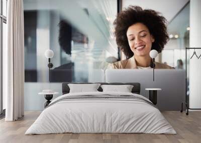 Young african american woman working with tablet in office Wall mural