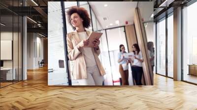 Young african american woman working with tablet in office Wall mural