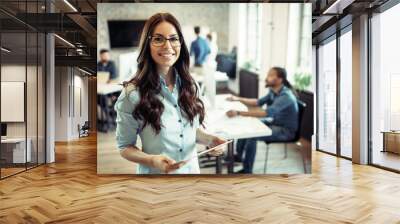 Young attractive architect working in modern office Wall mural