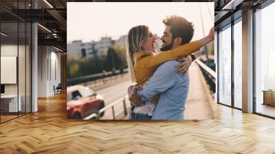 young couple hugging dating and kissing outdoor Wall mural