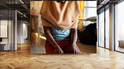 Young muslim black woman praying at home Wall mural