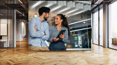 Young startup business people having fun, working and chatting at workplace office Wall mural