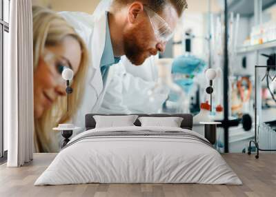 young students of chemistry working in laboratory Wall mural