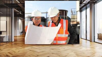 two engineer oil industry discussing a new project Wall mural