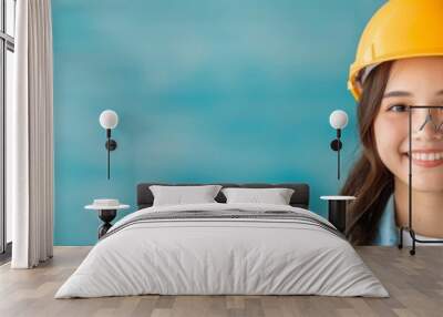 Smiling Female Engineer Wearing Yellow Safety Helmet Wall mural