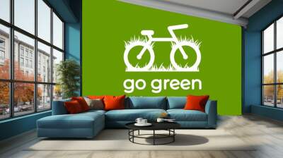 Go green logo. bicycle with grass. Flat bike logo isolated on green. Vector illustration. Wall mural