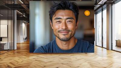 A promotional photo showcasing an Asian gentleman's genuine joy while donning a casual t-shirt. Wall mural